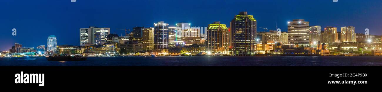 Halifax Harbor front with prominent business and financial buildings along with regional ferry. Halifax Skyline as seen from Dartmouth. Nova Scotia Stock Photo