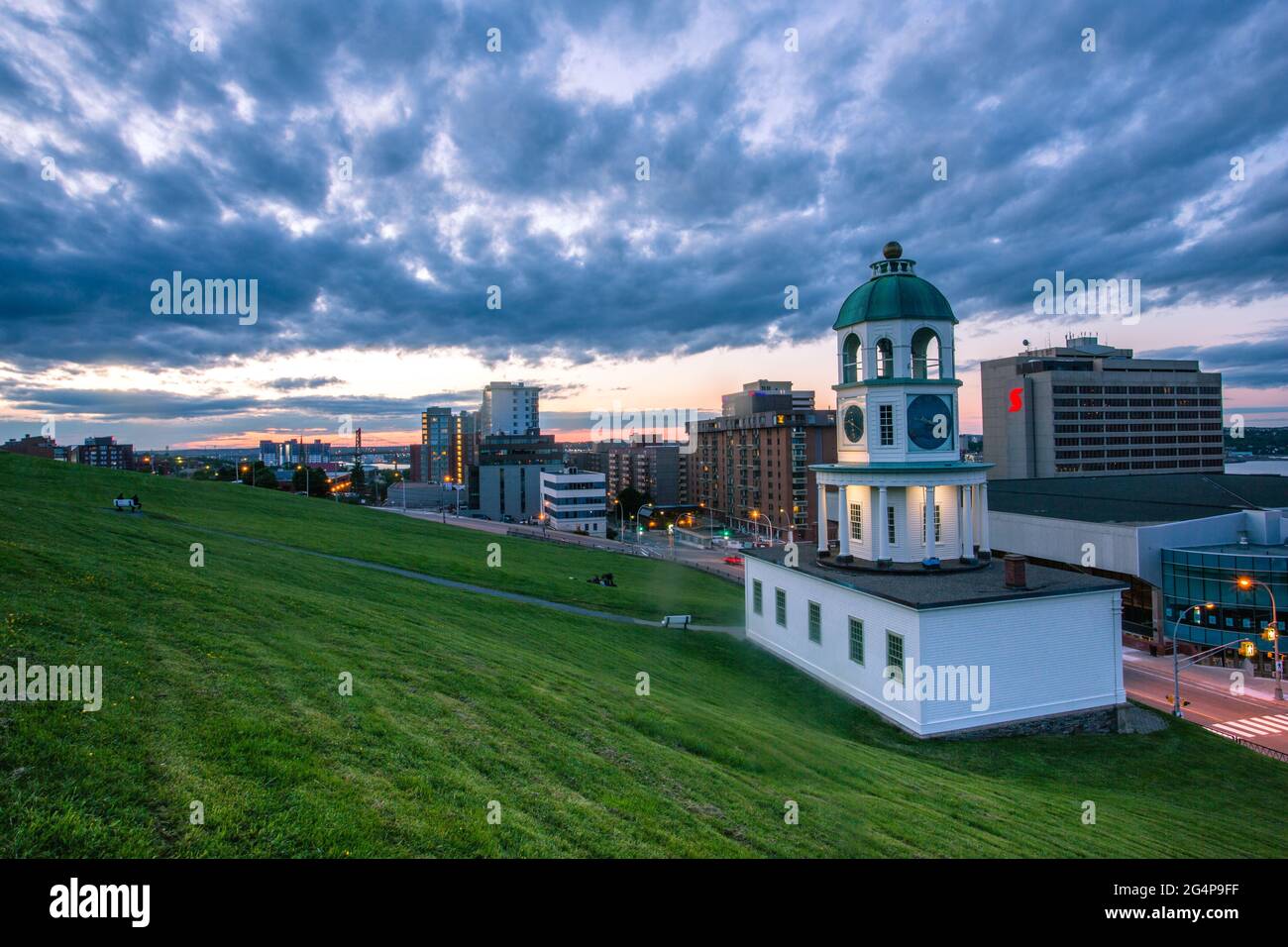 The iconic 120 year old town clock Halifax, an historic landmark of Halifax, Nova Scotia. Halifax Downtown as seen from Citadel Hill overlooking the T Stock Photo