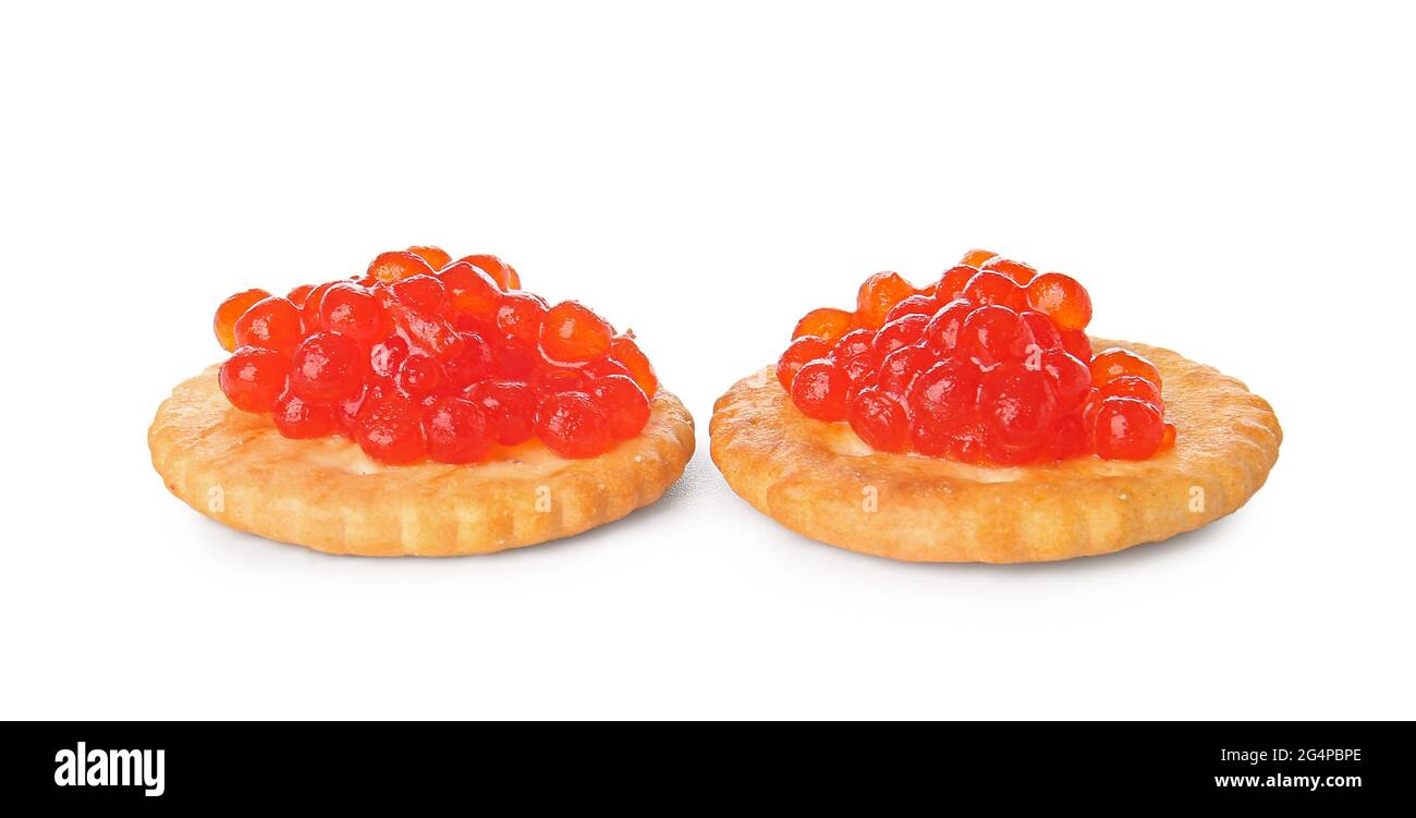 Tasty crackers with red caviar on white background Stock Photo Alamy