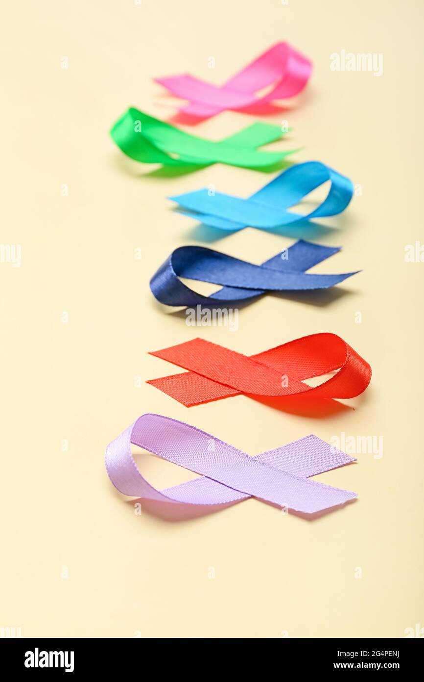 Different awareness ribbons on color background Stock Photo - Alamy