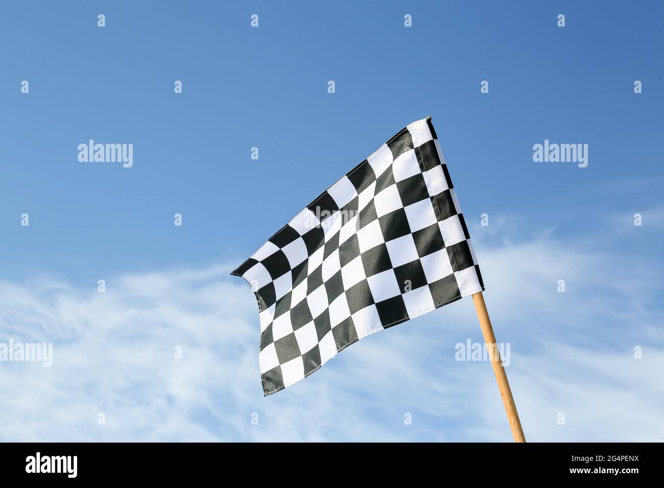 Chequered flag blue sky hi-res stock photography and images - Alamy