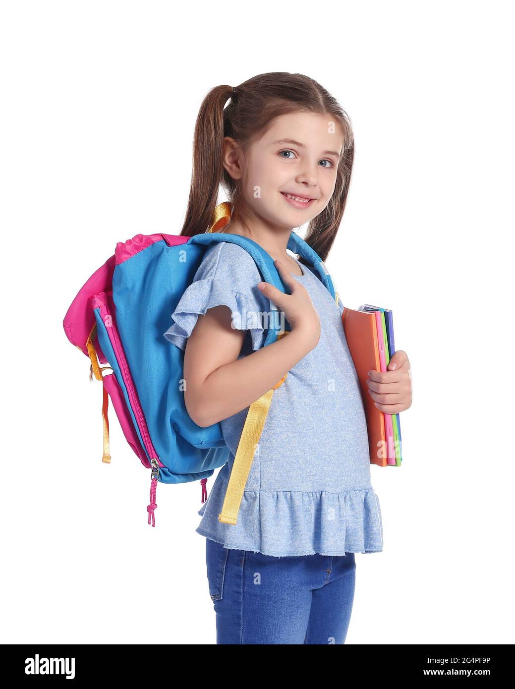 Little girl with backpack on white background Stock Photo - Alamy