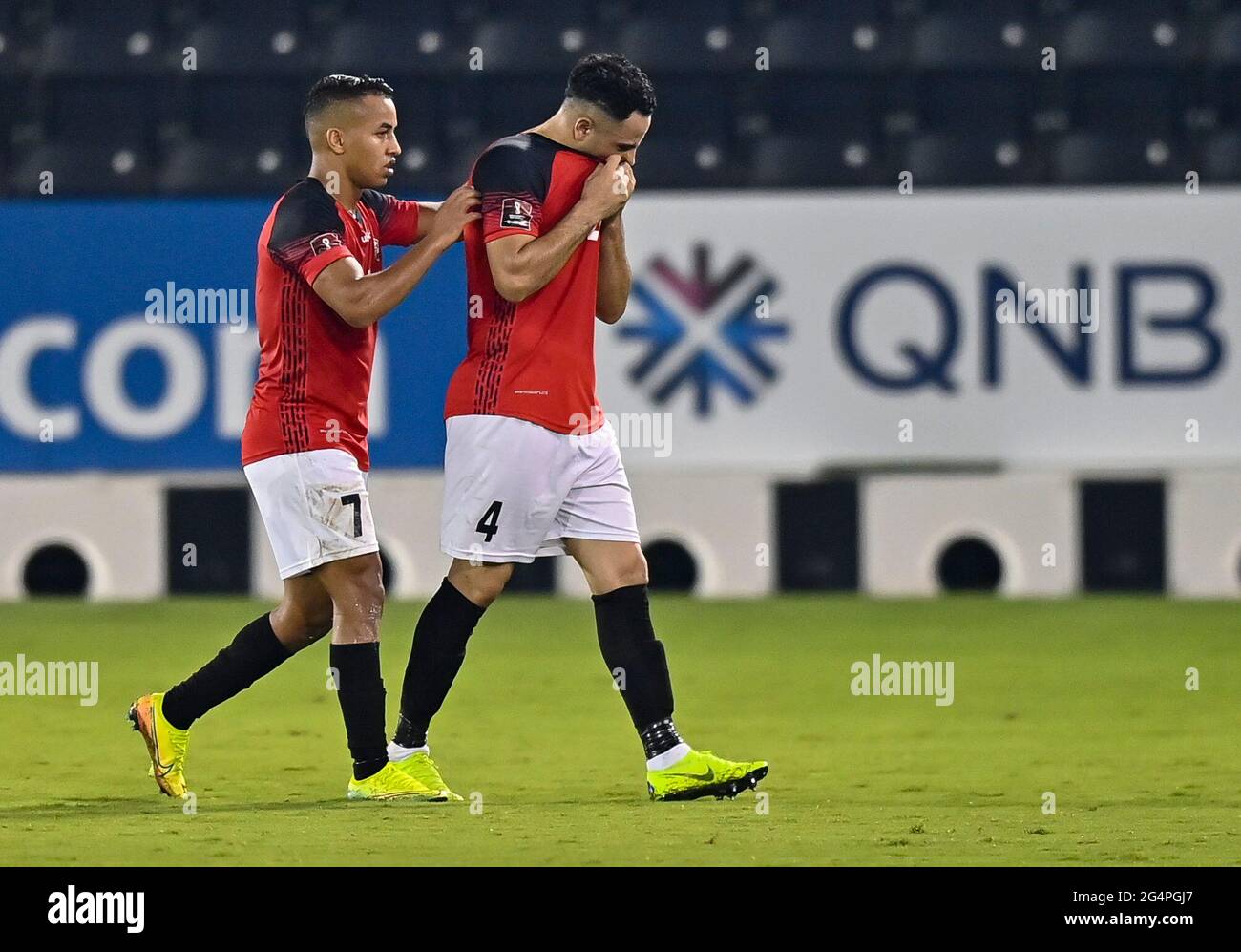 Doha, Qatar. 22nd June, 2021. Muder Al Radaei (R) of Yemen reacts as he leaves the field of play after being shown a red card during the FIFA Arab Cup Qatar 2021 qualifying round football match between Mauritania and Yemen in Doha, Qatar, June 22, 2021. Credit: Nikku/Xinhua/Alamy Live News Stock Photo