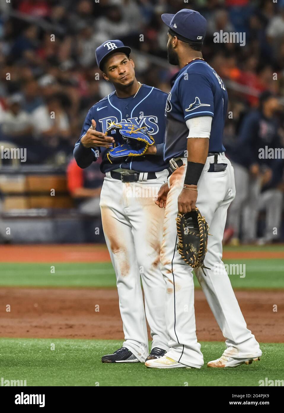 St. Petersburg, United States. 22nd June, 2021. Tampa Bay Rays infielders Wander  Franco (L) and Yandy Diaz (R) talk during a pitching change in the third  inning of a baseball game at