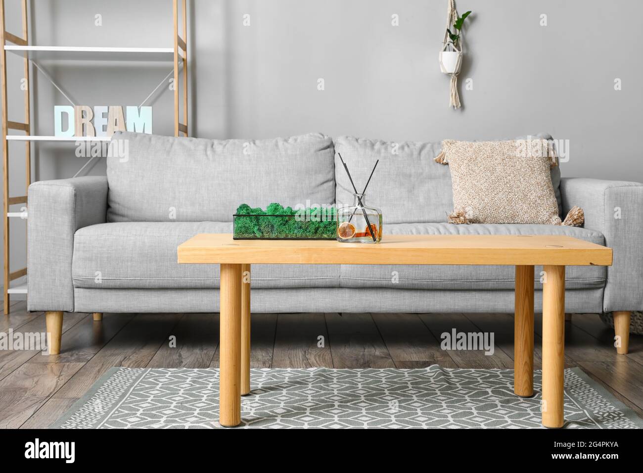 Interior of modern room with sofa and table Stock Photo - Alamy
