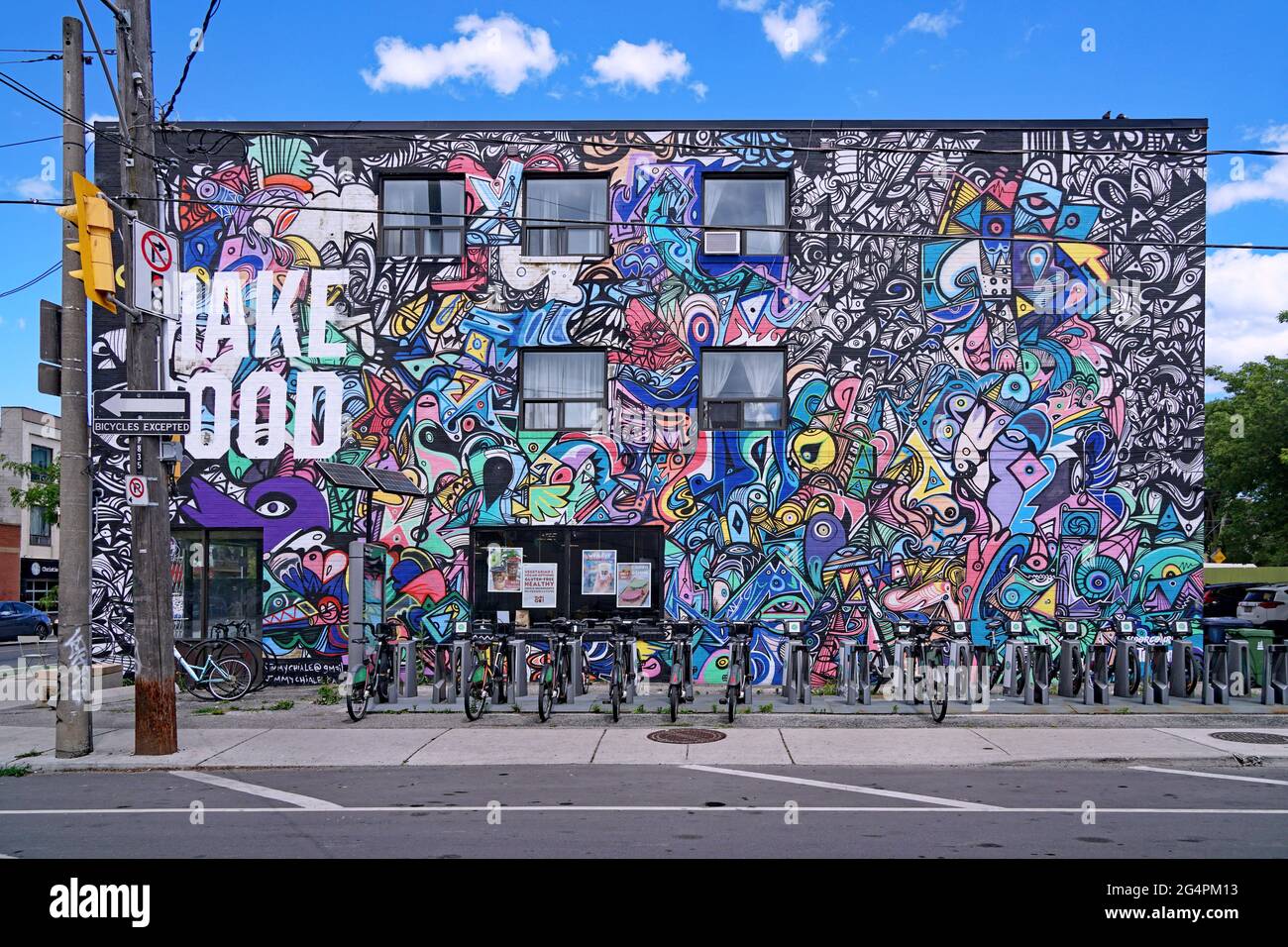 Toronto, Canada - Vegan restaurant in a trendy downtown neighborhood with an abstract mural by artist Jimmy Chiale on its outside wall, https://www.ji Stock Photo
