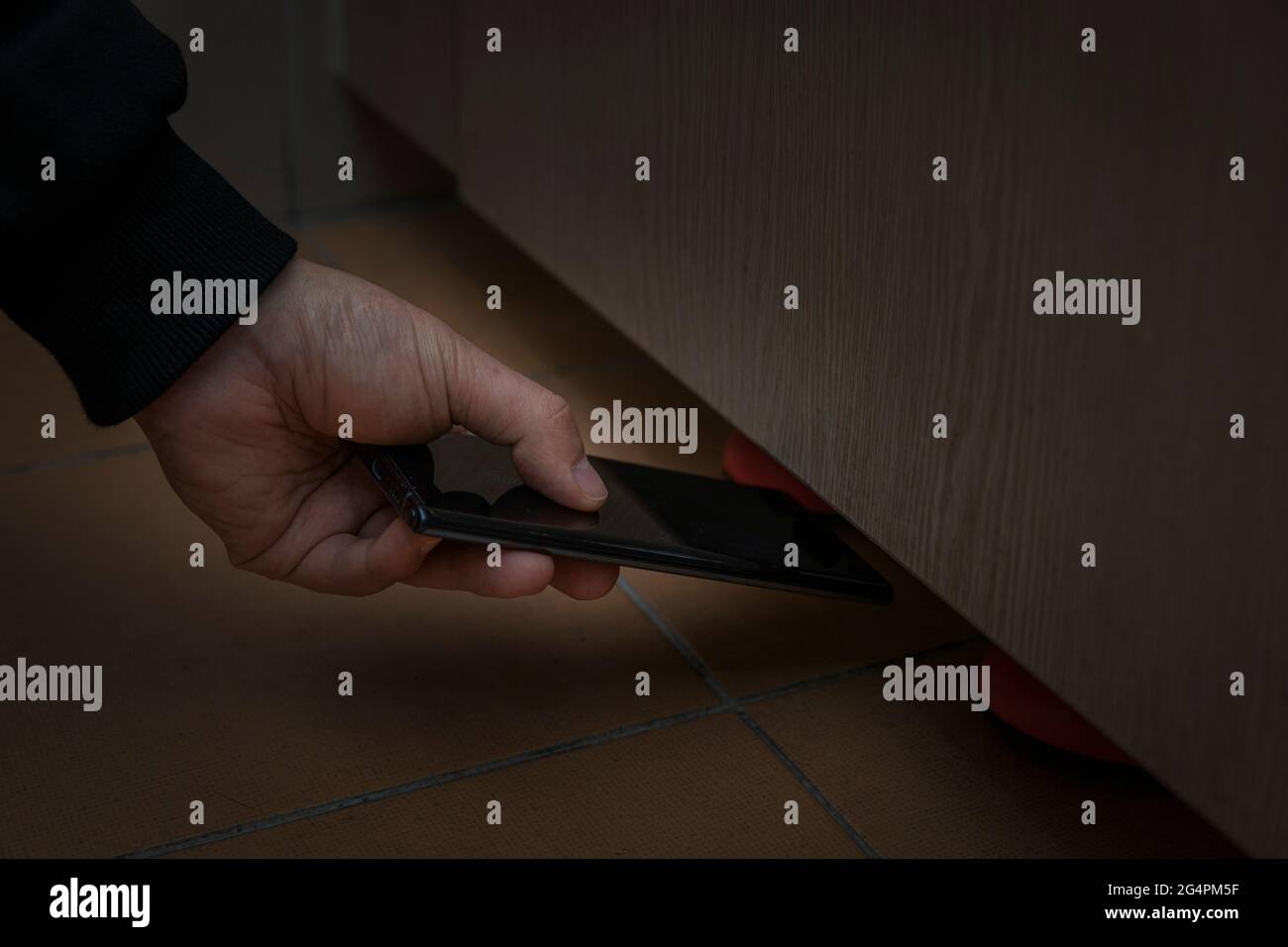 criminal taking illegal photos, video in restroom Stock Photo Alamy