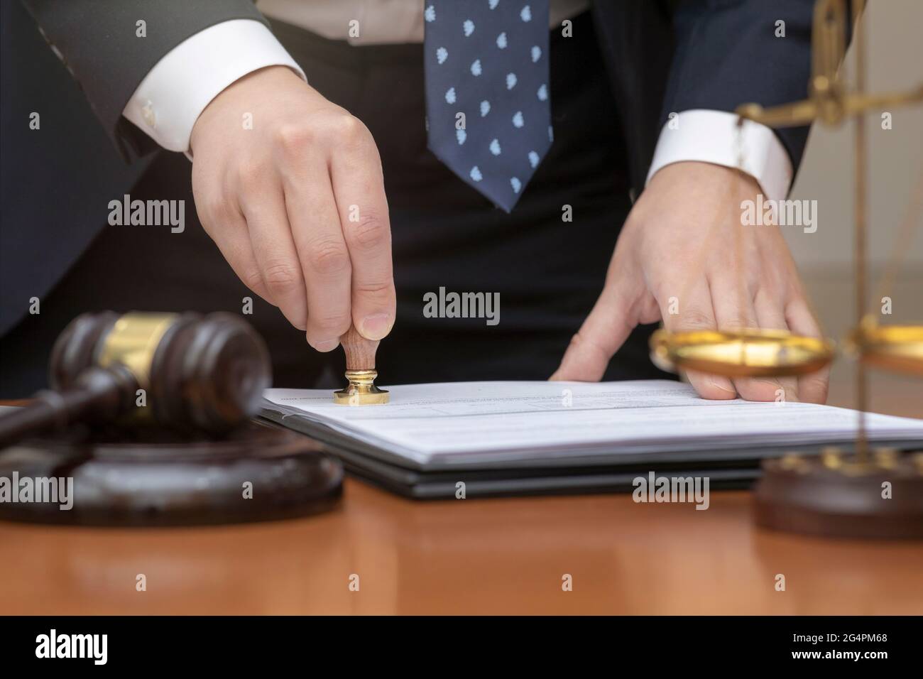 crime and legal concept, judge stamping seal on document, paper Stock