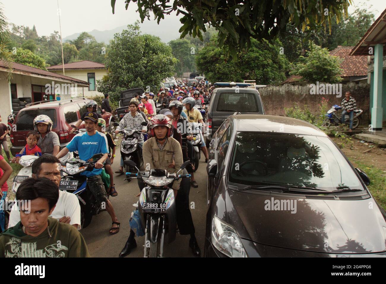 Mount Salak, West Java, Indonesia. May 11, 2012. Traffic congestion in a village at the foot of Mount Salak during the search and rescue mission for the Sukhoi Superjet 100 (SSJ-100) plane that crashed on the mountain on May 9. Stock Photo