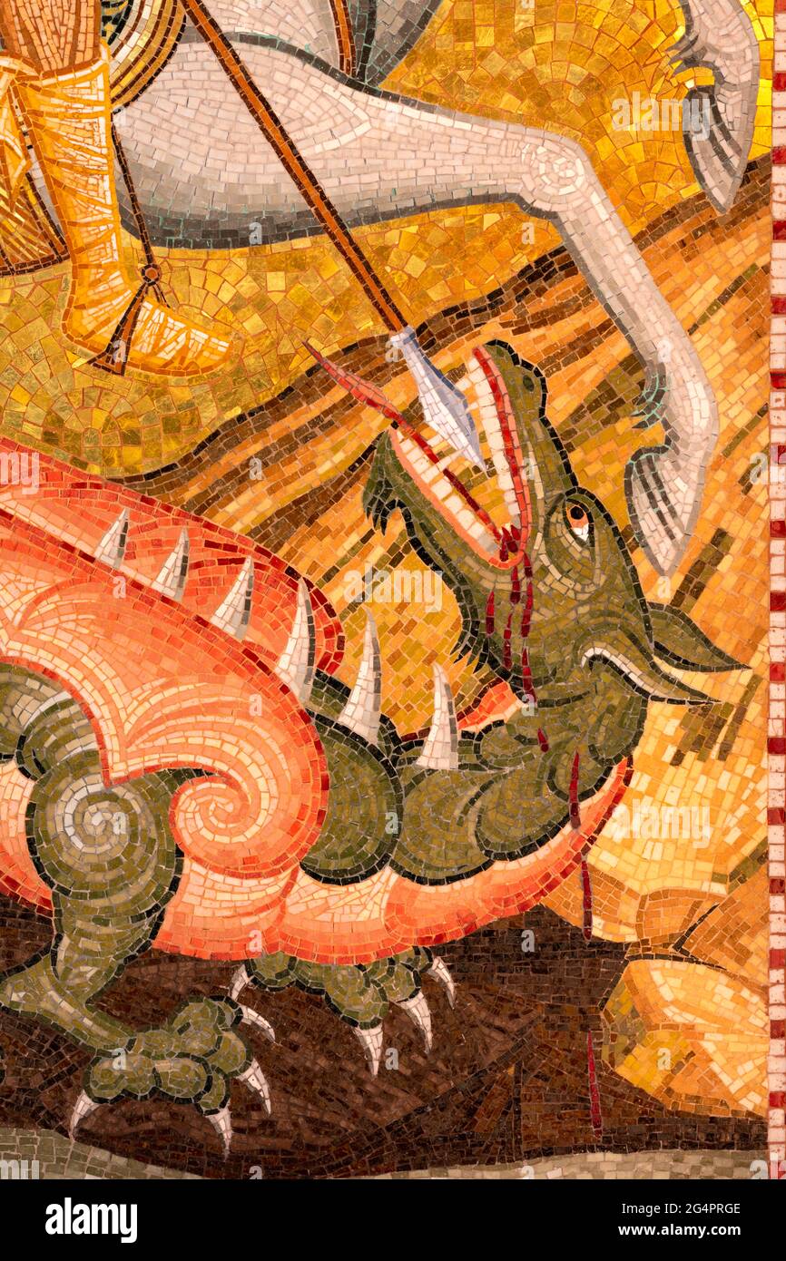 Closeup of slaying dragon that demanded human sacrifices from St. George on horseback mosaic. Stock Photo