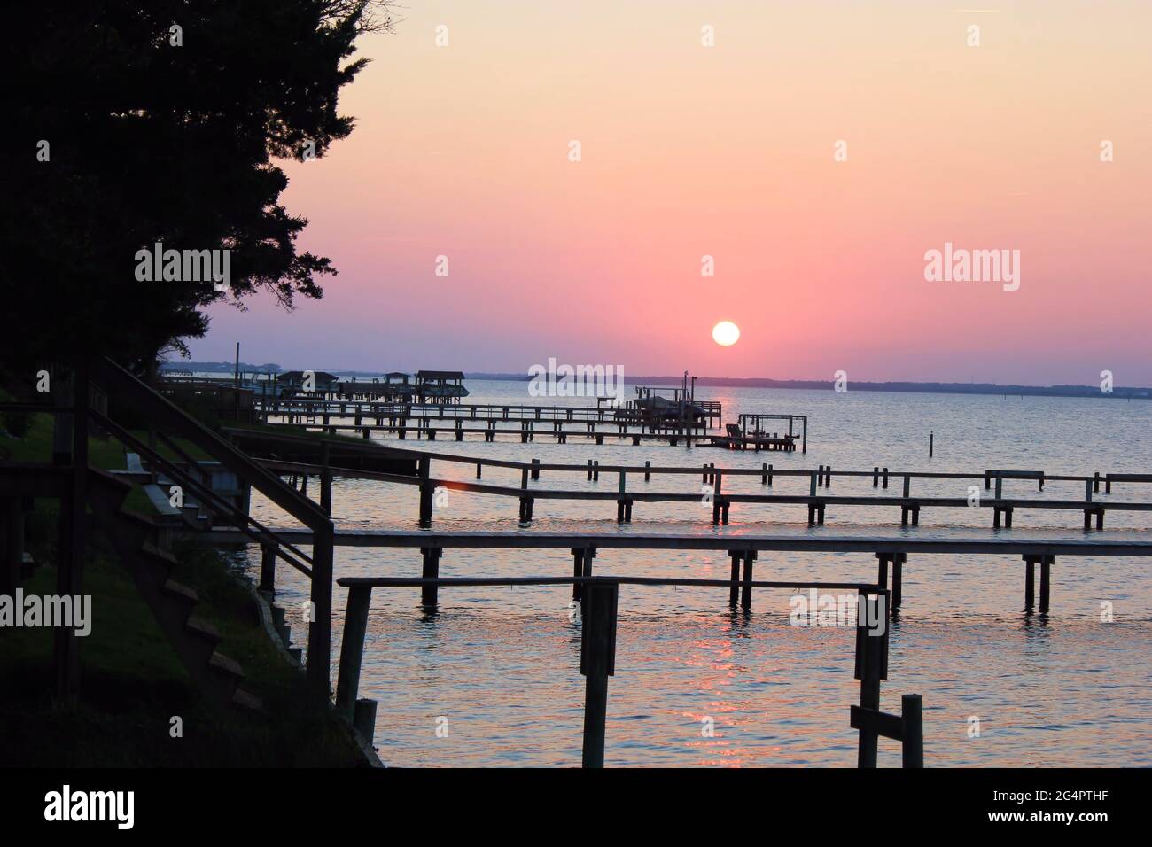 Relaxing sunset over the piers at Emerald Isle, NC Stock Photo Alamy