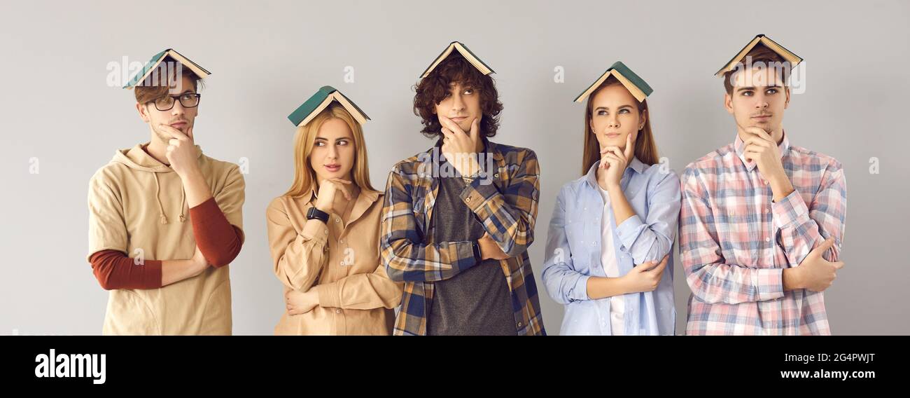 Group of funny college or university students with books on tops of head  thinking hard Stock Photo - Alamy