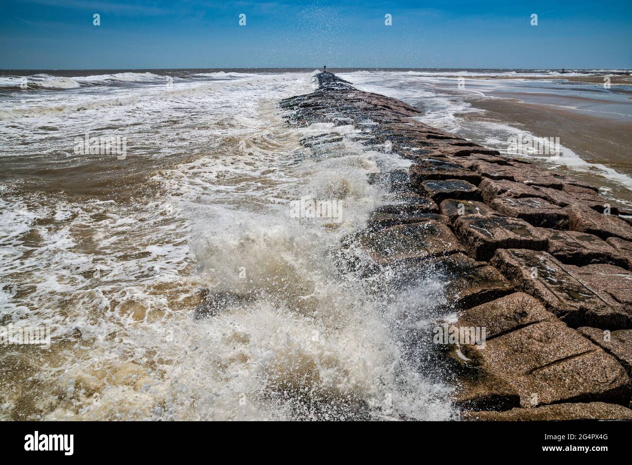 Waves hitting rock breakwater at Matagorda Peninsula near Colorado