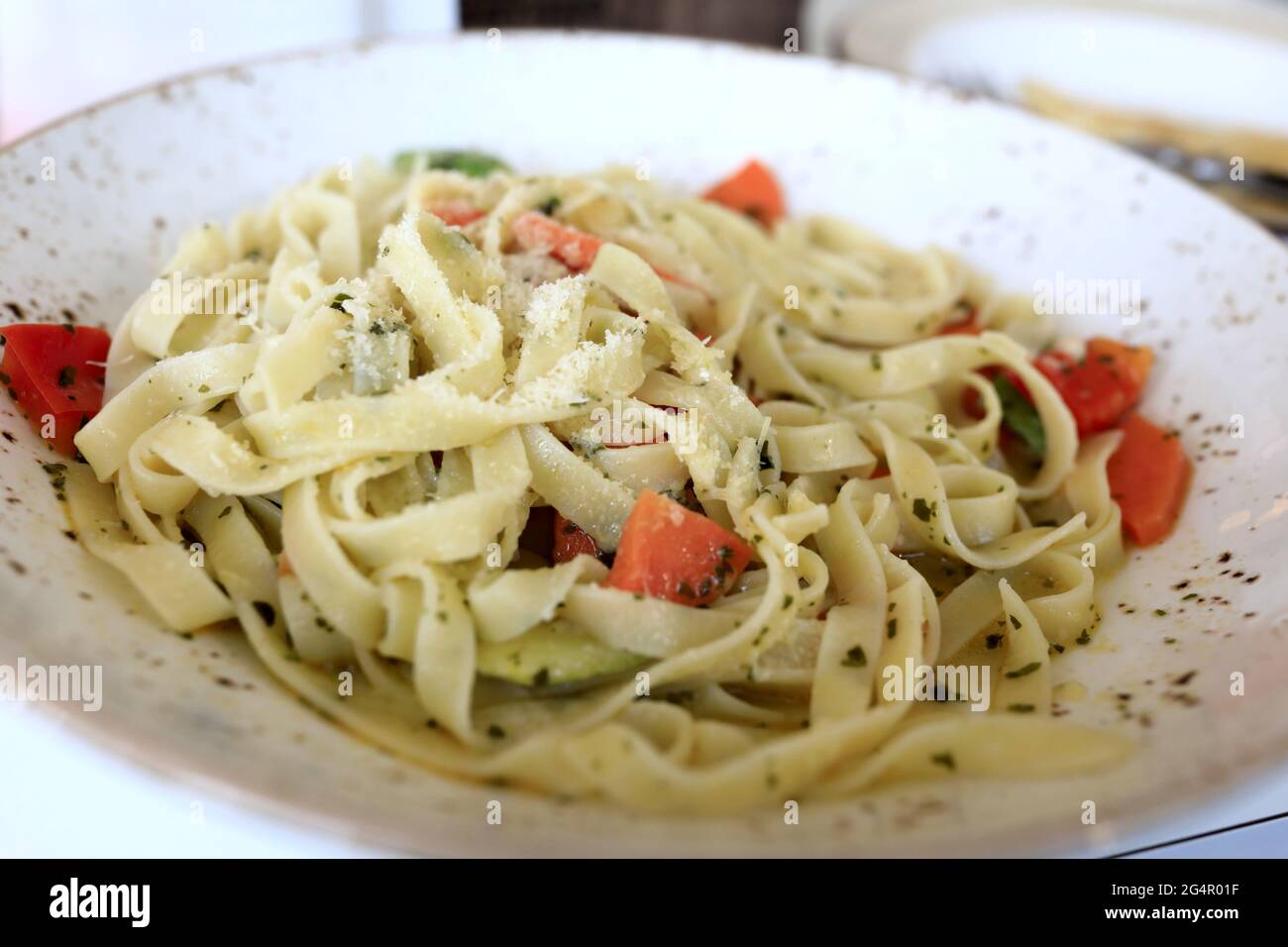 Fettuccine pasta with vegetables in a restaurant Stock Photo Alamy
