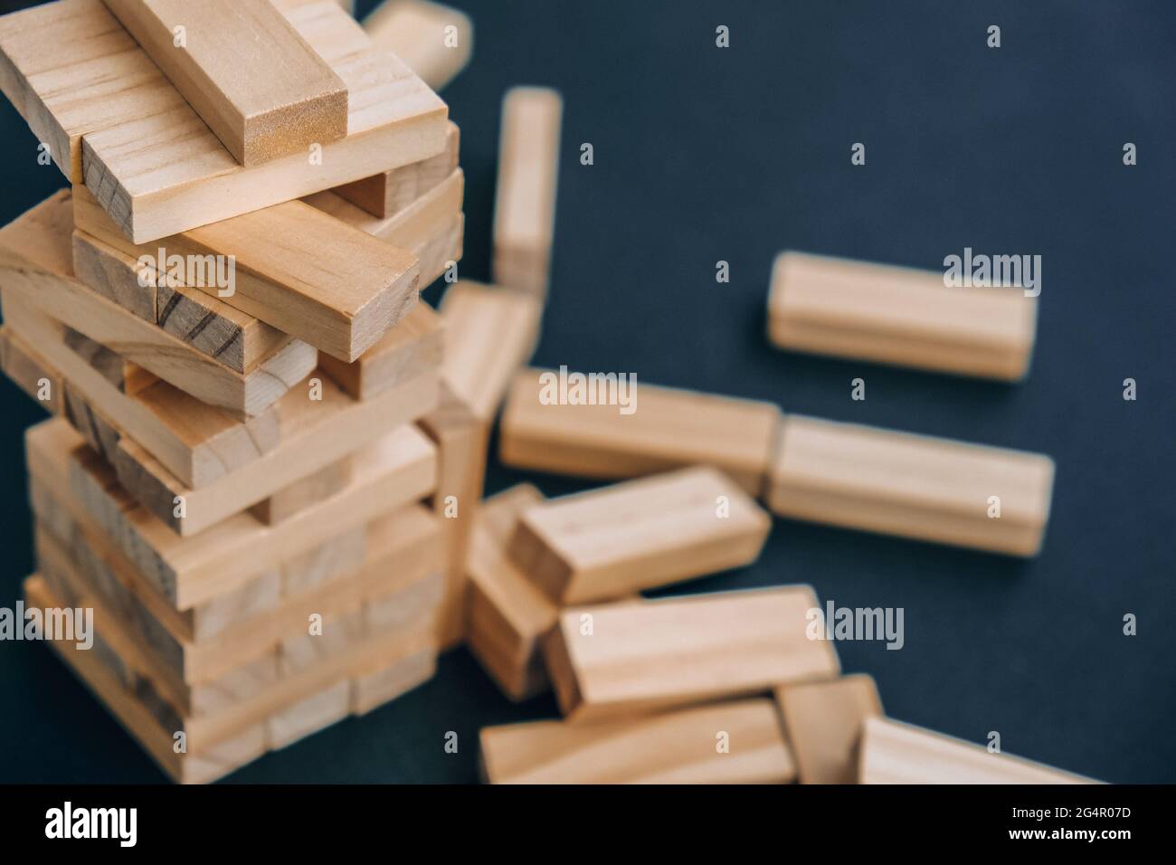 Building from wooden blocks. Wood blocks stack game with Hand on ...