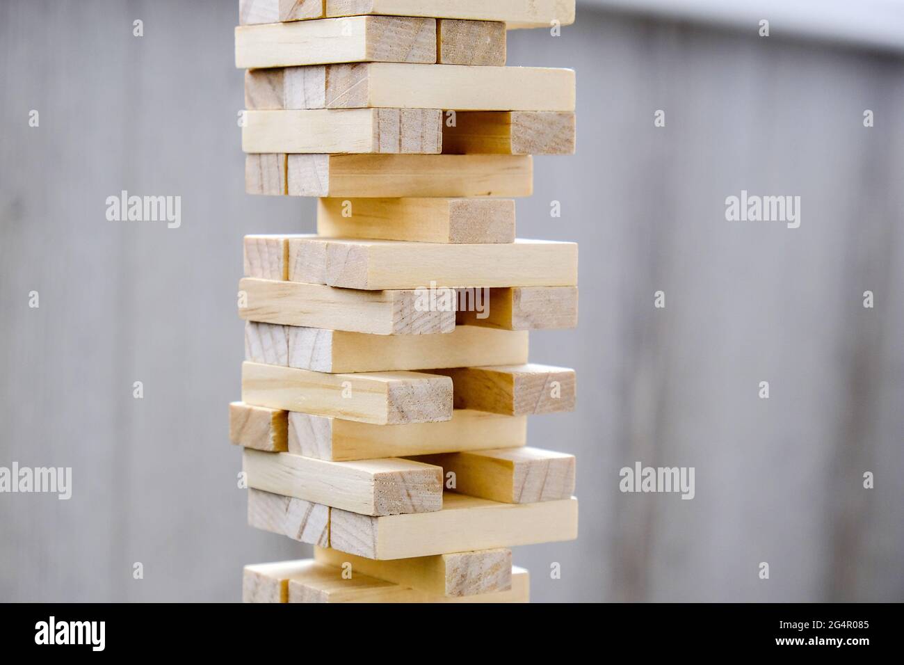 Building from wooden blocks. Wood blocks stack game with Hand on ...