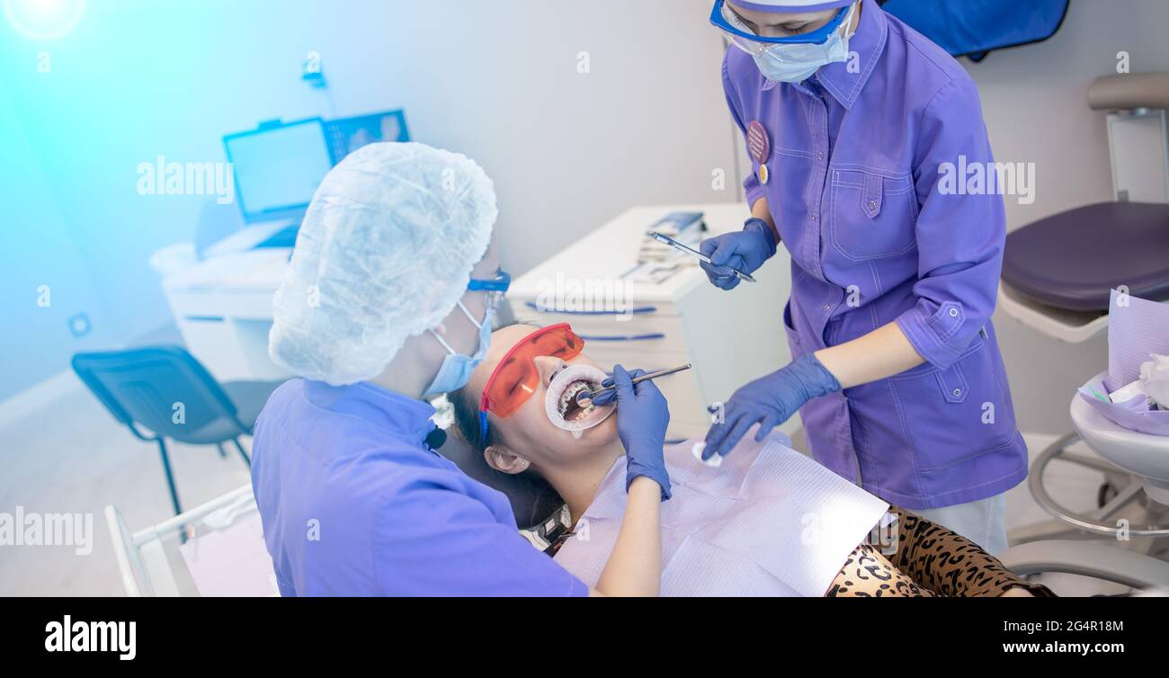 Dentistry, installation of braces, etching of teeth with gel Stock
