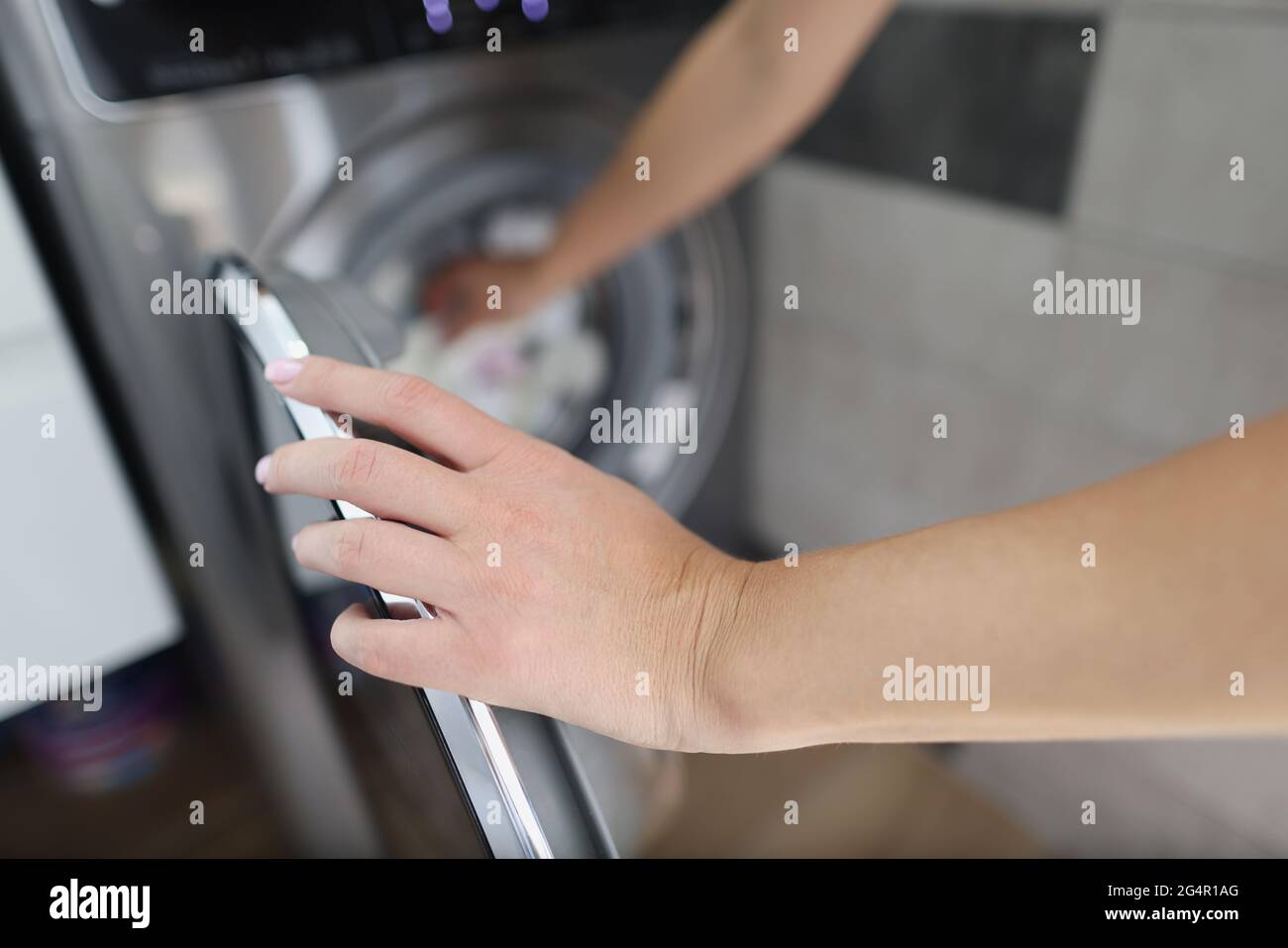 Wet carpet is drying outside. Cloth thing hangs on pole. Natural drying of  rug in sunlight Stock Photo - Alamy