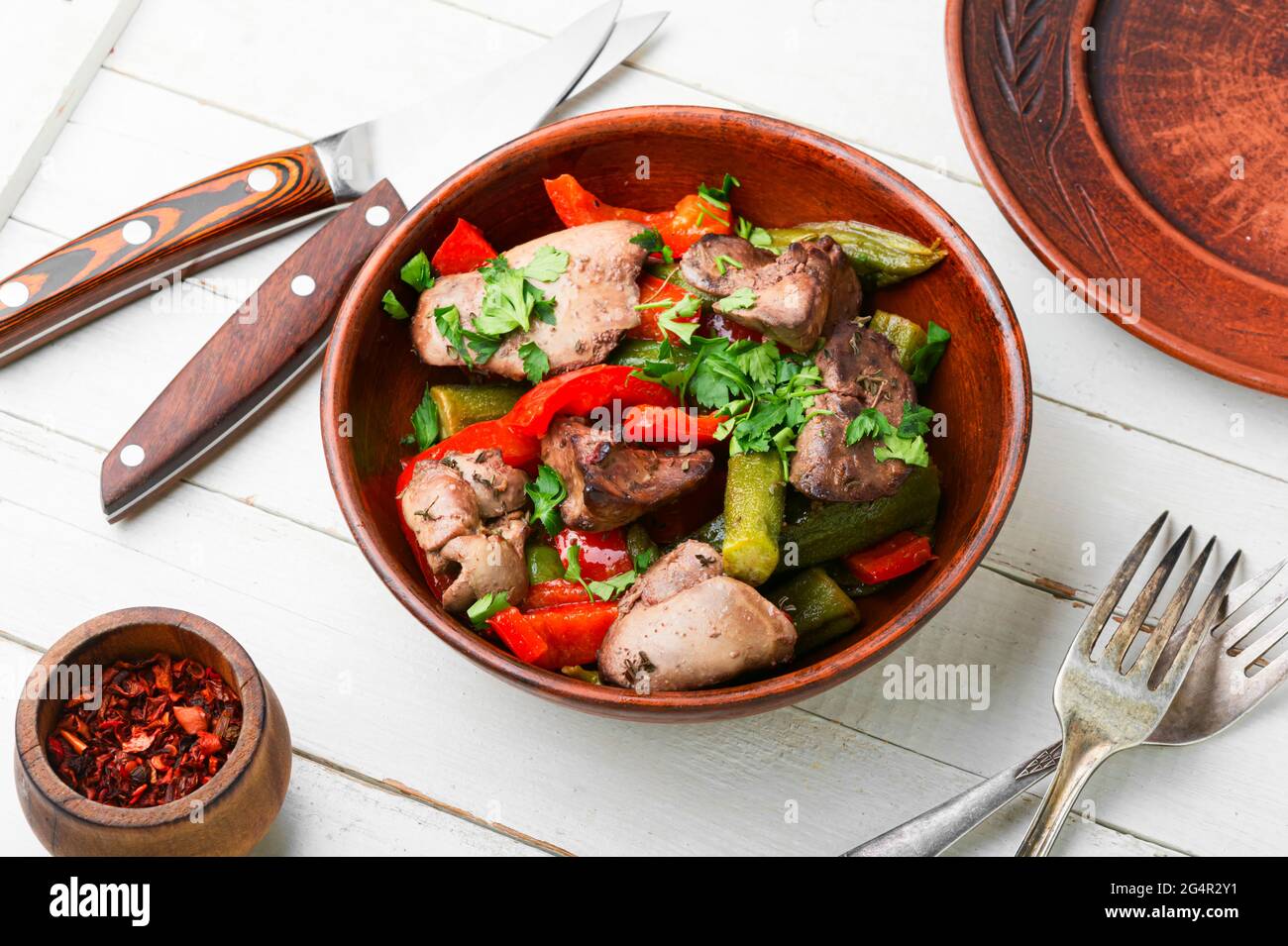 Salad with liver,bell pepper,okra and herbs.Chicken liver salad Stock Photo