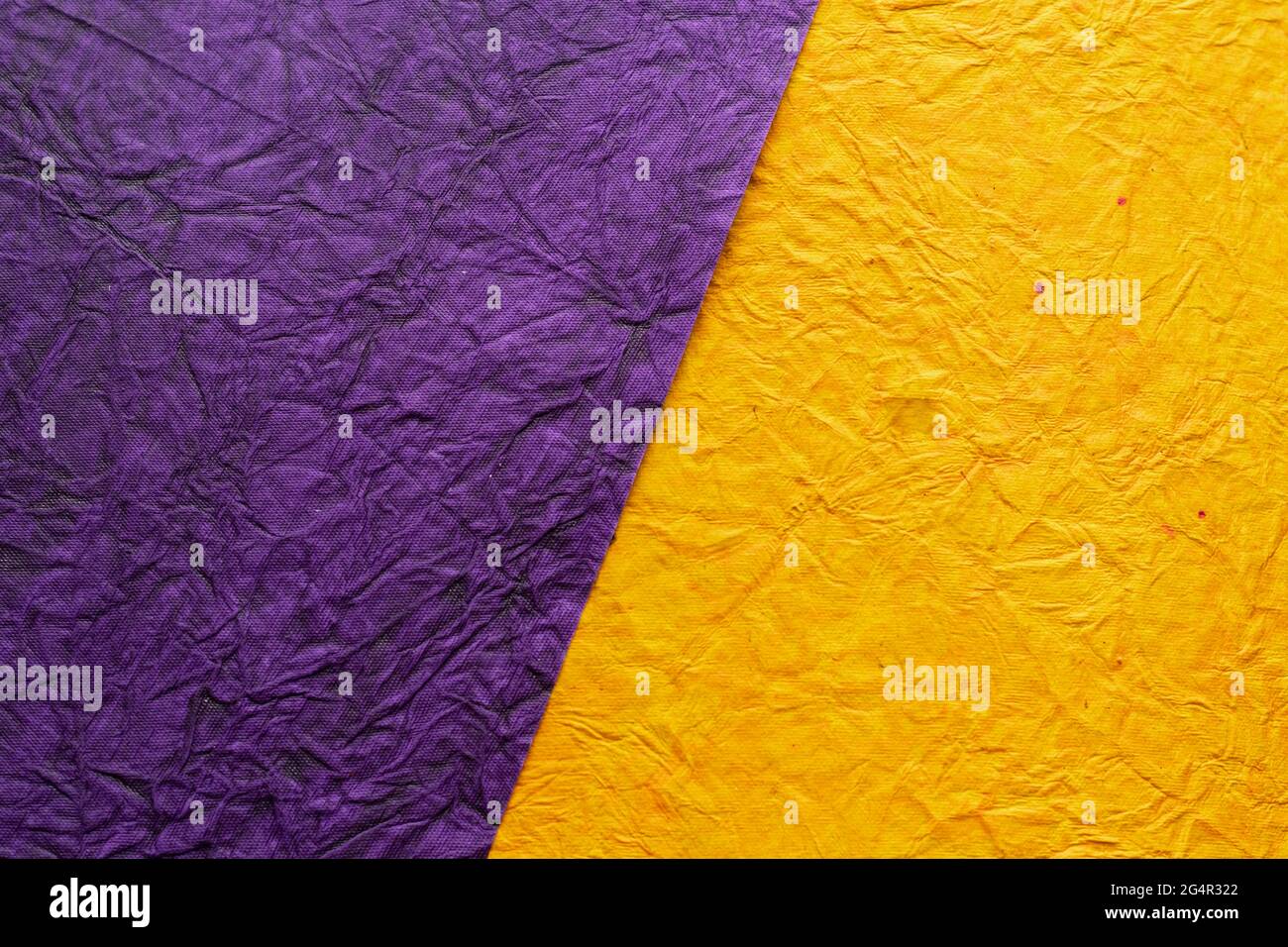 Splited Background with yellow and violet coloured crushed paper Stock ...