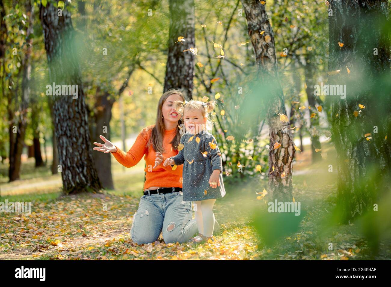 cute baby girl with mom in the park. beautiful autumn in the park Stock ...