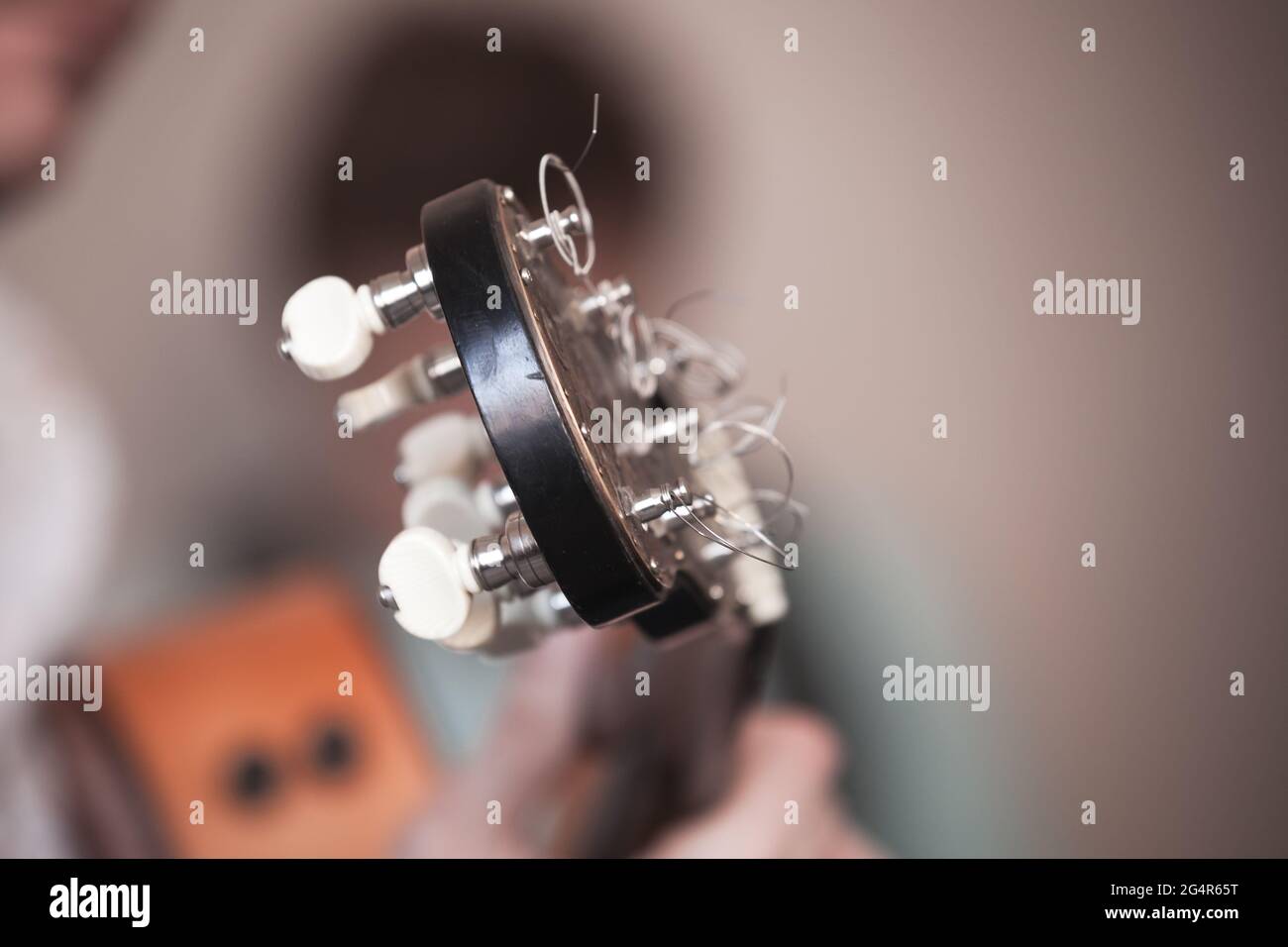 Acoustic guitar head, closeup photo with selective soft focus Stock