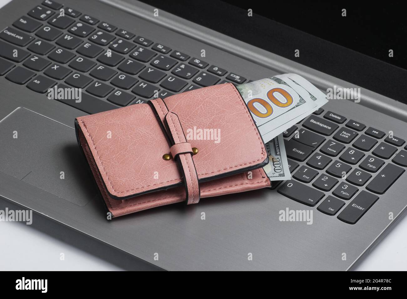 Online shopping minimalistic concept. Purse with dollar bills on laptop ...