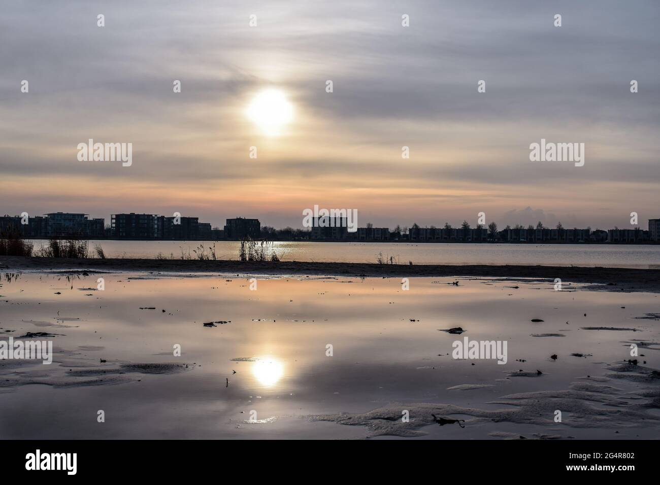 Beautiful sunset with a reflection in the water Stock Photo - Alamy