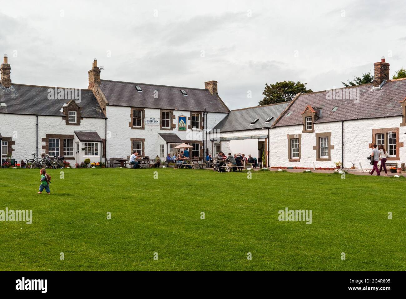 The Ship Inn, a whitewashed country pub, on the green at Low Newton By The Sea, Northumberland, UK Stock Photo
