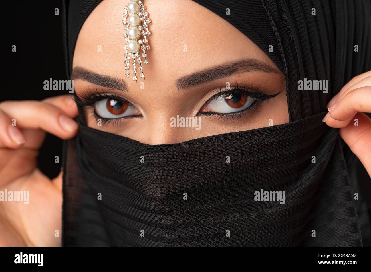 Close up portrait of beautiful muslim girl dressed in hijab Stock Photo ...
