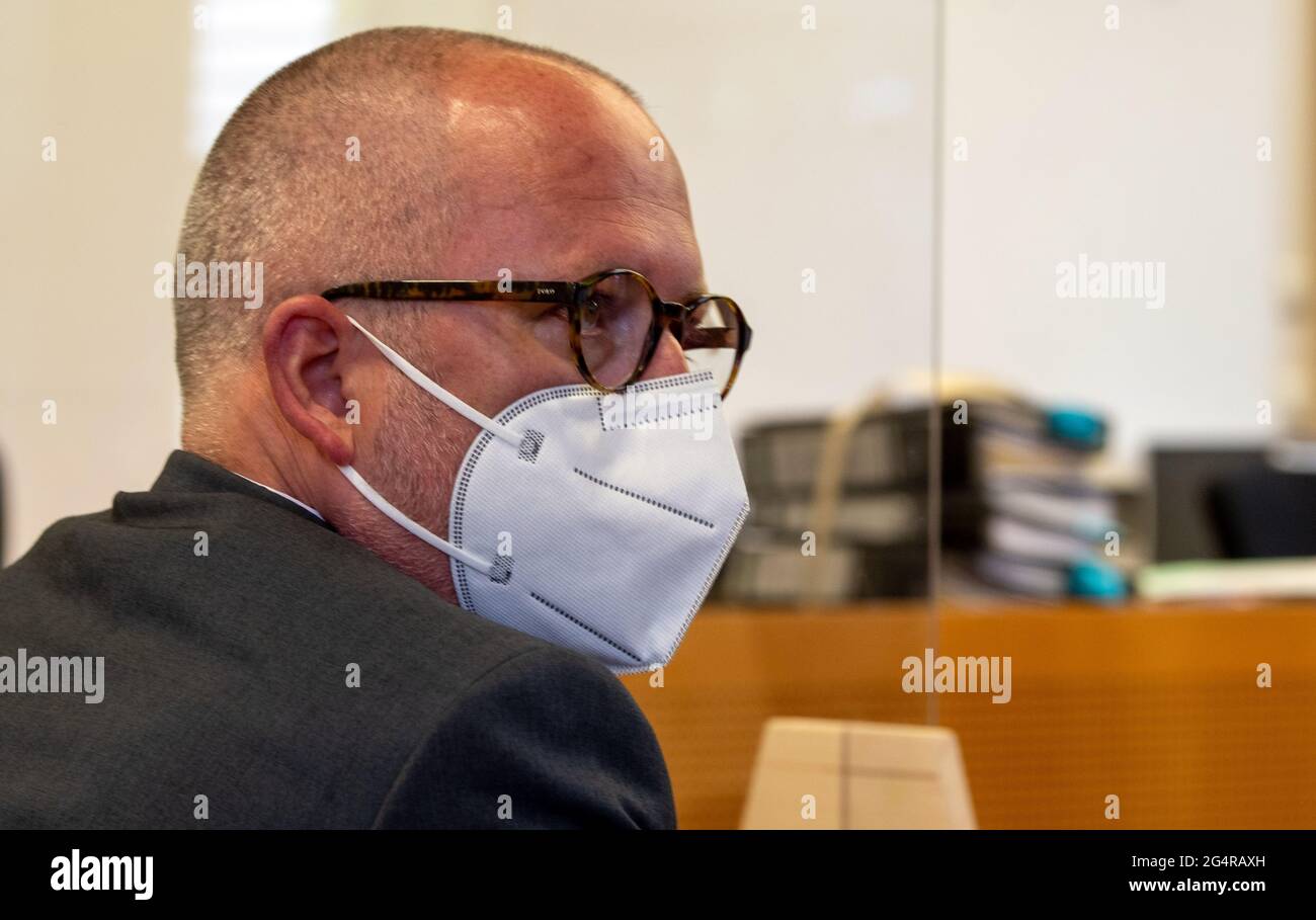 Augsburg, Germany. 23rd June, 2021. Peter Hummel (Free Voters) is sitting in the district court. The public prosecutor's office accuses the local politician, among other things, of slander, insult and attempted extortion. Credit: Stefan Puchner/dpa/Alamy Live News Stock Photo
