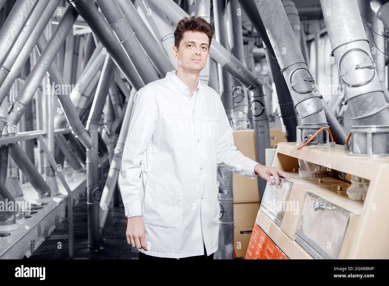 Worker Operator Checks Mill Production Line Of Cereals Flour Millet And Seeds Food Industry Service Concept Stock Photo Alamy