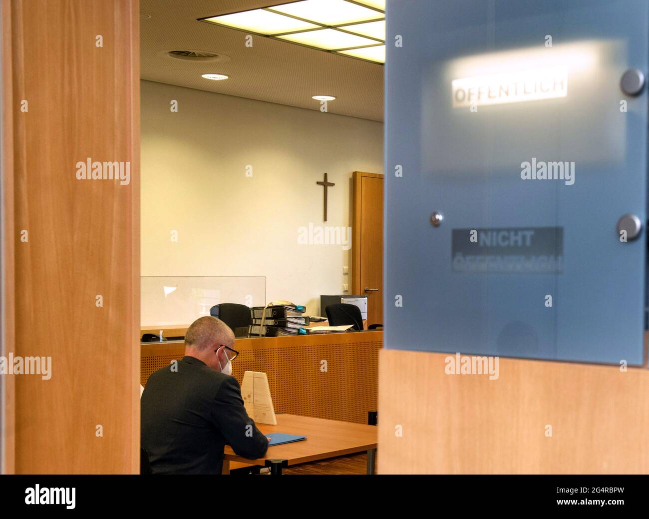 Augsburg, Germany. 23rd June, 2021. Peter Hummel (Free Voters) is sitting in the district court. The public prosecutor's office accuses the local politician, among other things, of slander, insult and attempted extortion. Credit: Stefan Puchner/dpa/Alamy Live News Stock Photo