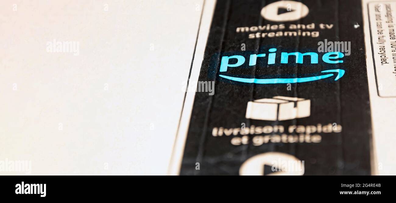 Rome, Italy, June 2021: The Amazon Prime logo printed on the black safety tape on a cardboard box. Packaging for shipping and online shopping. Illustr Stock Photo
