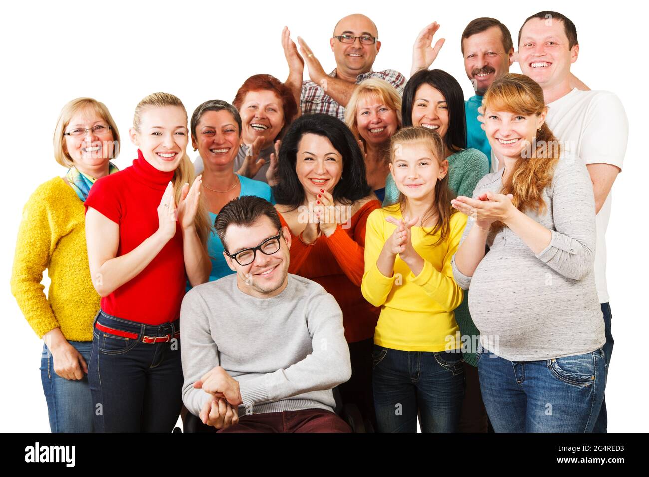 Portrait of a large group of a Mixed Age people smiling and embracing together with Disabled Man. Stock Photo