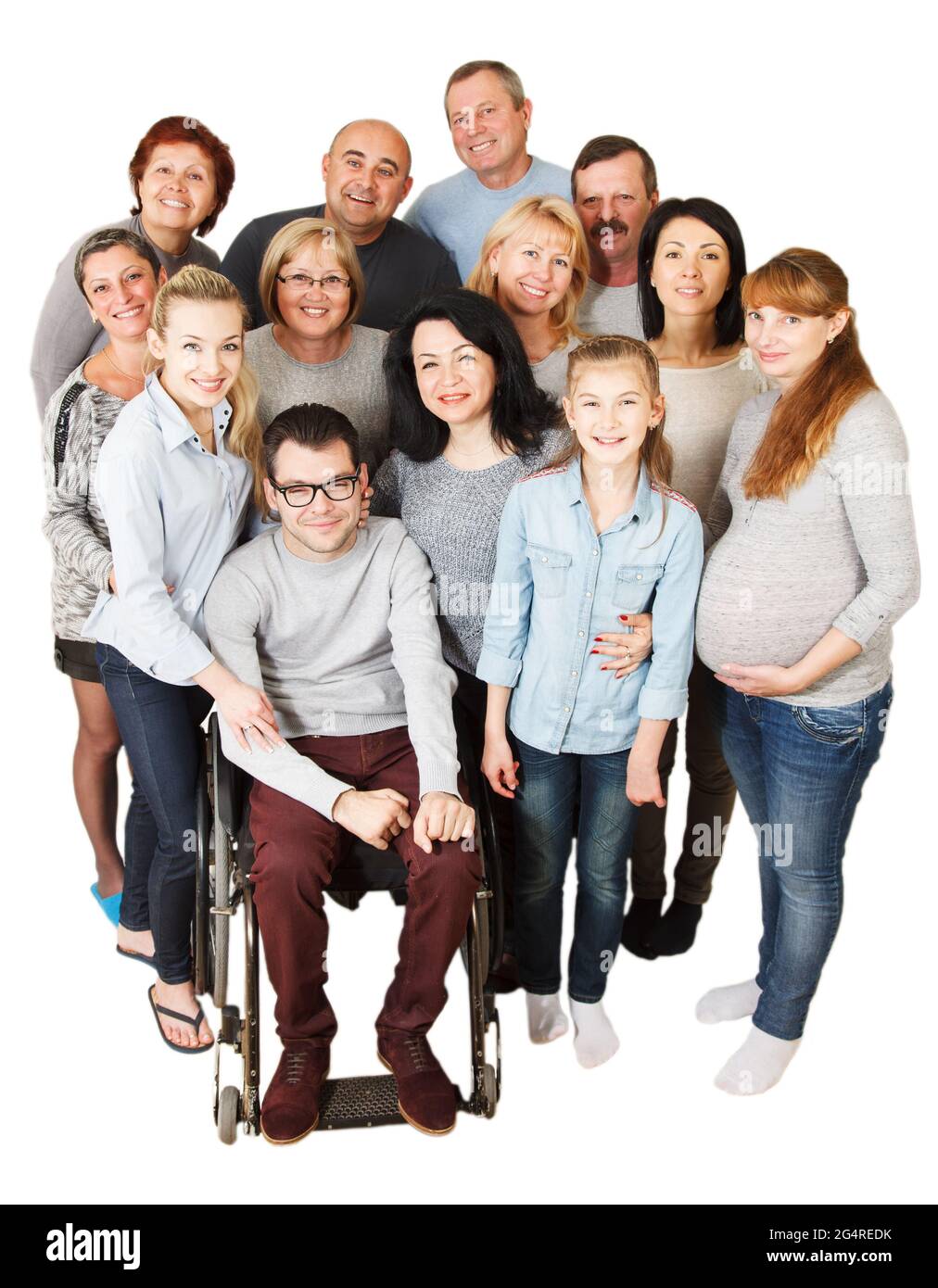 Portrait of a large group of a Mixed Age people smiling and embracing together with Disabled Man. Stock Photo