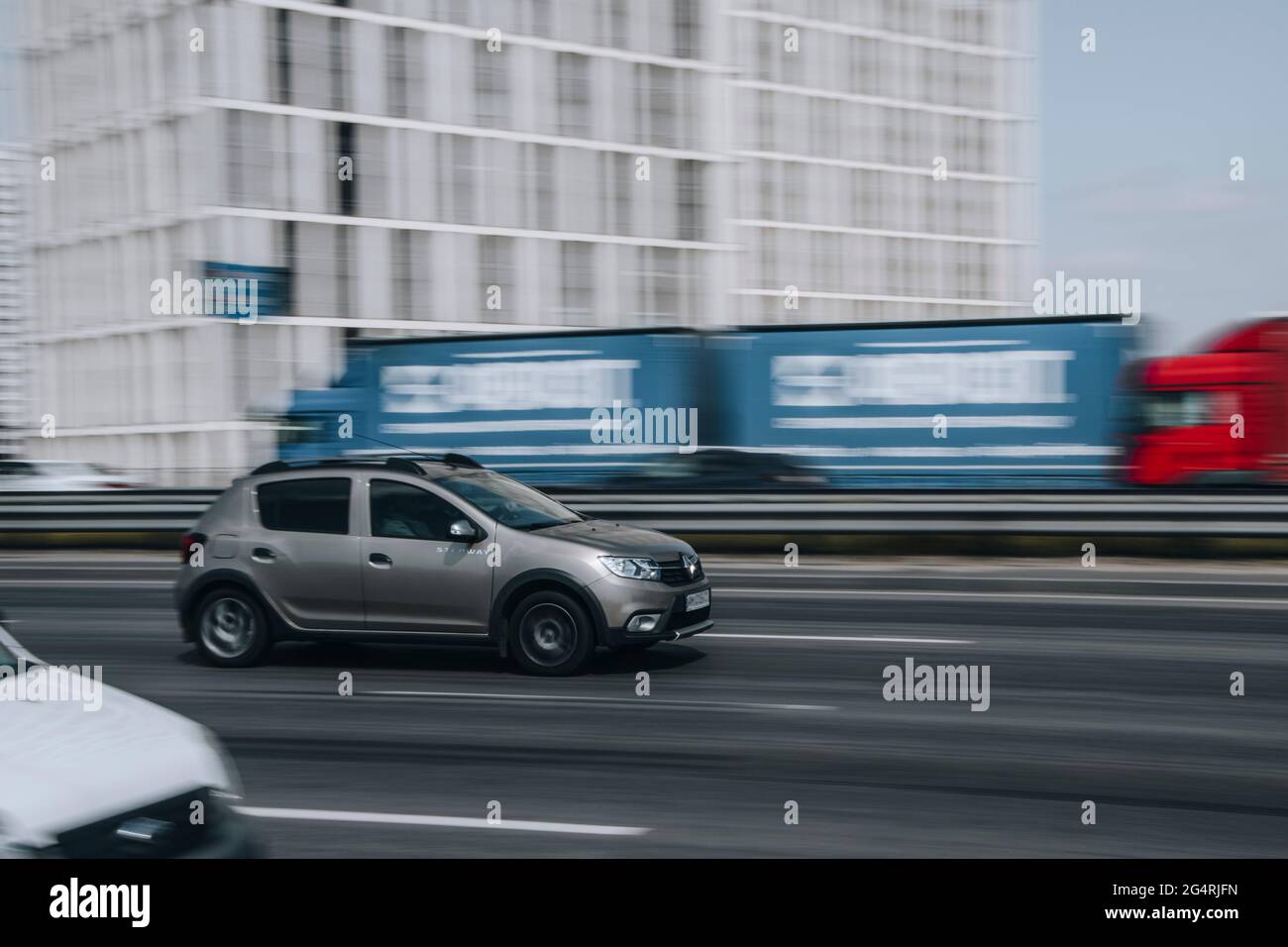 Ukraine, Kyiv - 29 April 2021: Silver Dacia Sandero car moving on the street. Editorial Stock Photo