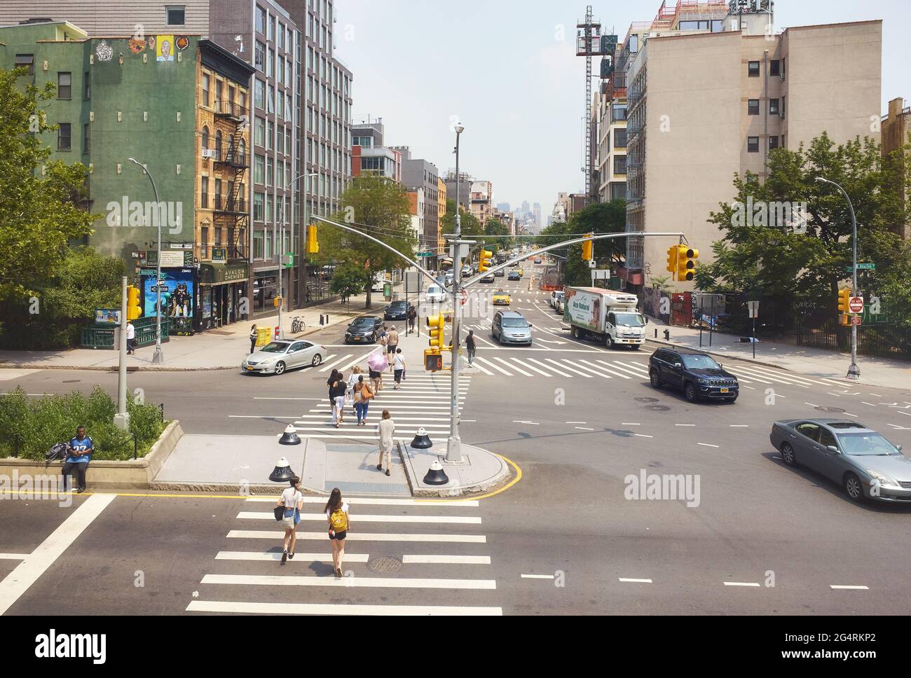 New York, USA - July 03, 2018: 2nd Avenue and East Houston Street busy intersection on a summer day. Stock Photo