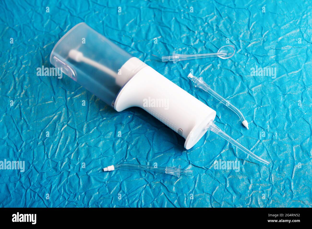 Electric dental irrigator with different nozzles - tools for teeth hygiene. Stock Photo