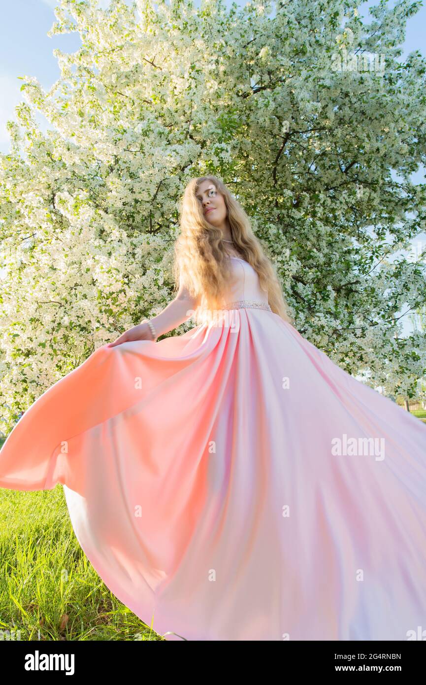 Woman in pink beautiful dress hi-res stock photography and images - Alamy