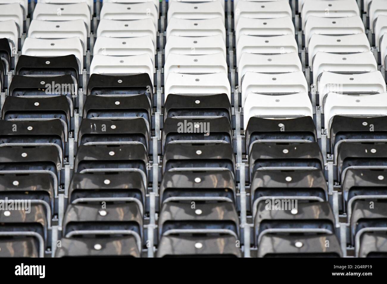Rows of black and white seats at the Swansea.com stadium. Stock Photo