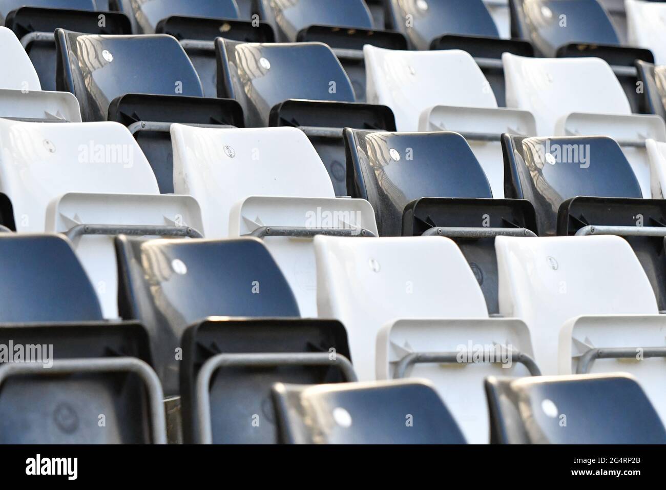 Rows of black and white seats at the Swansea.com stadium. Stock Photo
