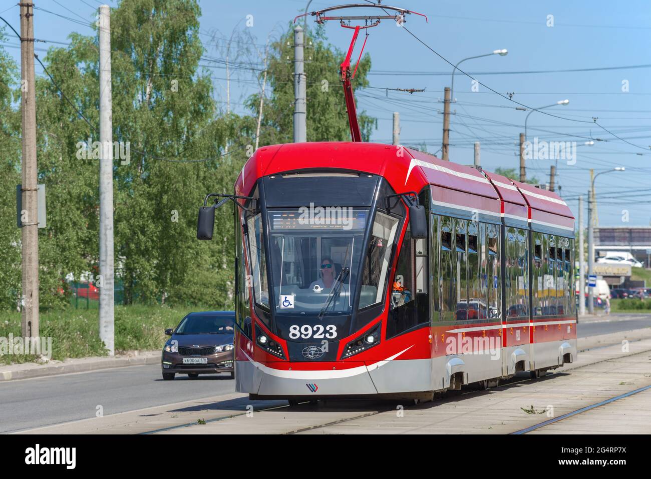 SAINT-PETERSBURG, RUSSIA - JUNE 04, 2021: Modern low-floor tram 71-931M 'Vityaz-M' on a city street on a sunny June day Stock Photo