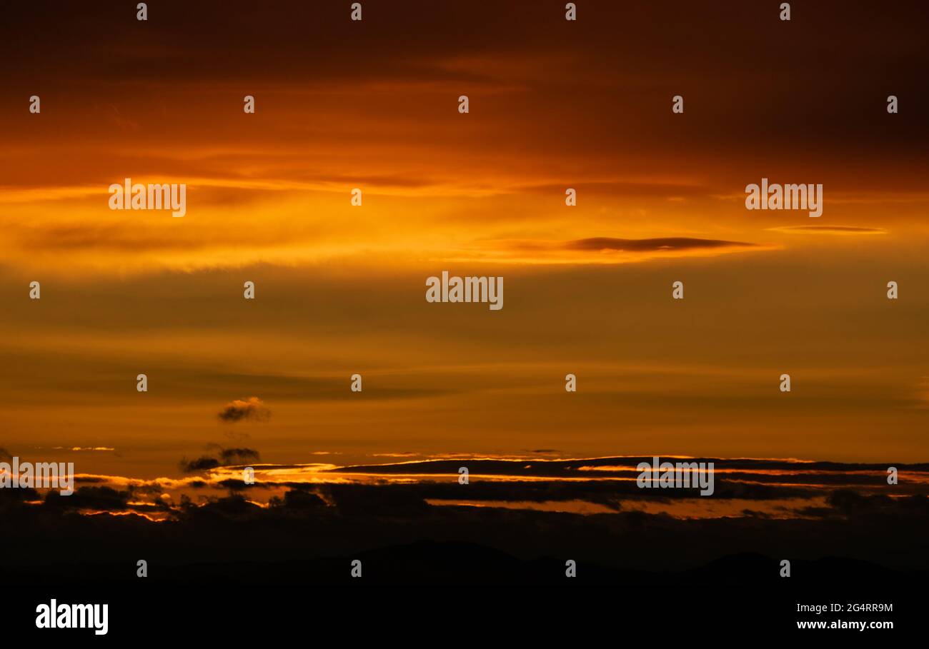 Sunset sky with orange clouds. Nature background Stock Photo - Alamy