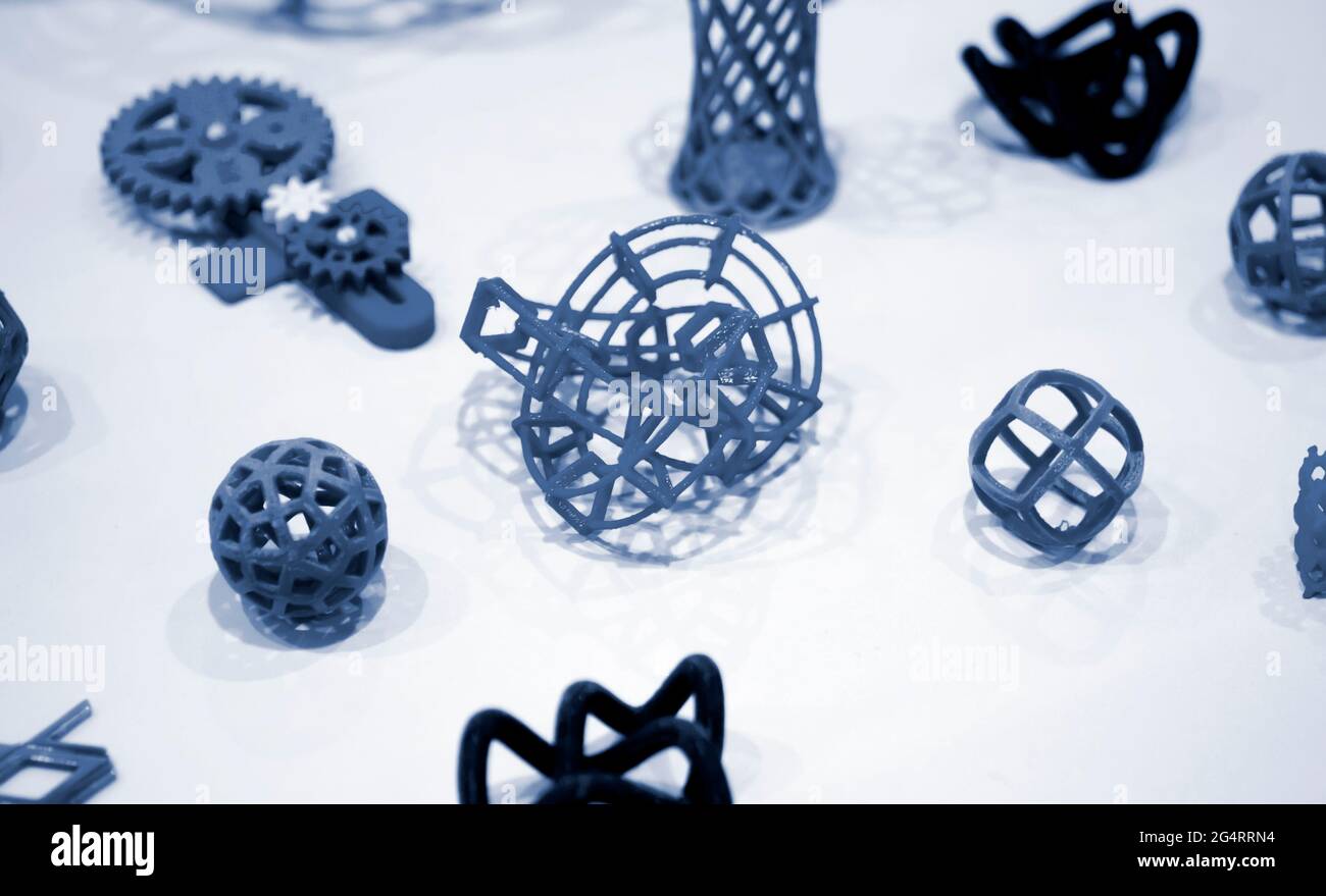 Many abstract models printed by 3d printer close-up. Stock Photo