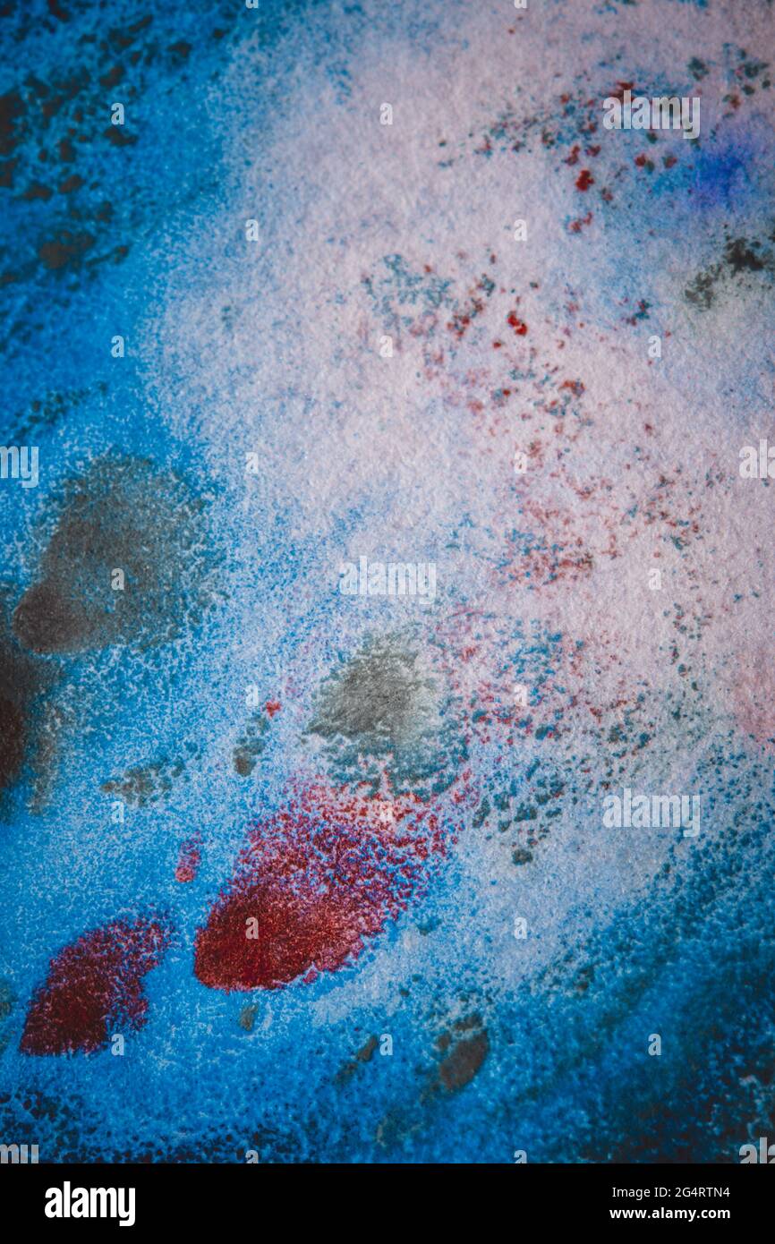 Multicolored paint stains, drips, splashes, mixing. Abstract background Stock Photo