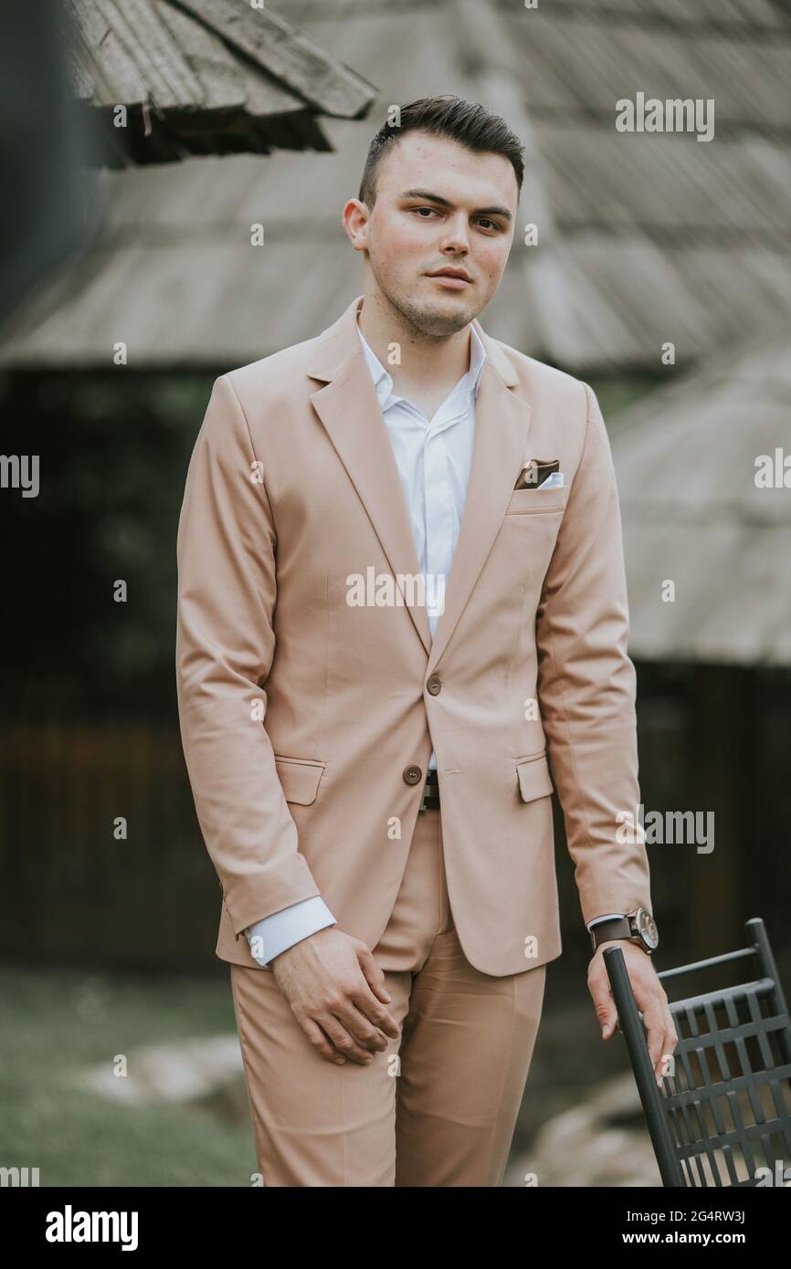 Caucasian young businessman in a suit standing outdoor Stock Photo - Alamy