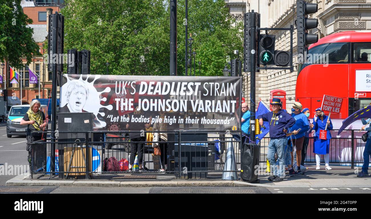 Parliament Square, London, UK. 23 June 2021. Anti Brexit action group Sodem Action take over junctions leading to Parliament at Parliament Square in Westminster with large banners and vocal protests. Credit: Malcolm Park/Alamy Live News Stock Photo