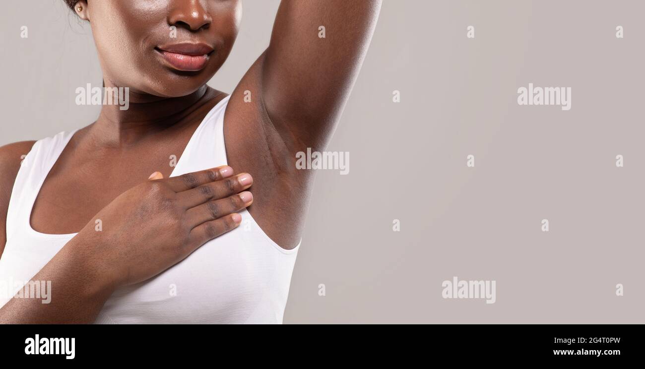 Hair Removal Concept. Young Black Woman Showing Her Smooth Skin On Underarm,  African Female Demonstrating Hairless Armpit, Standing Isolated Over Grey  Stock Photo - Alamy
