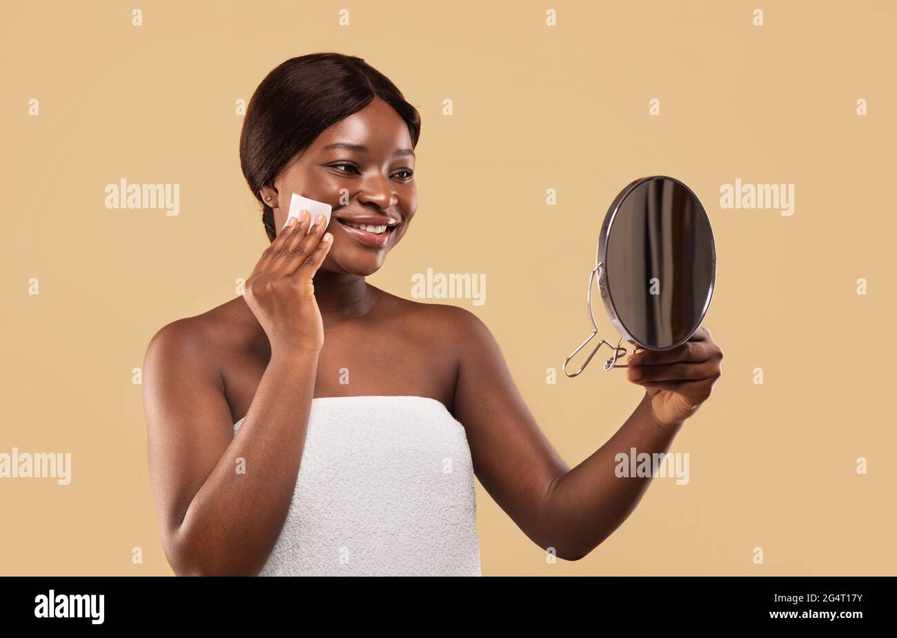 Smiling Black Woman Using Matt Control Blotting Papers And Looking In